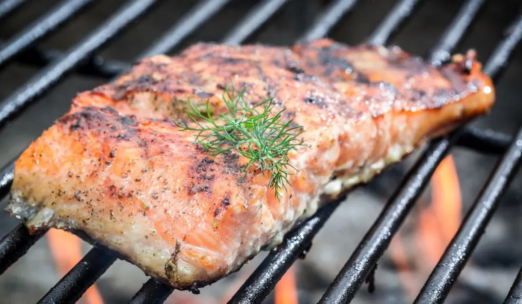 Baked salmon on the grill with fire
