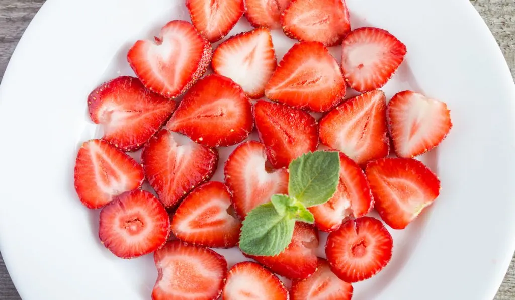 Sliced Strawberries on white plate