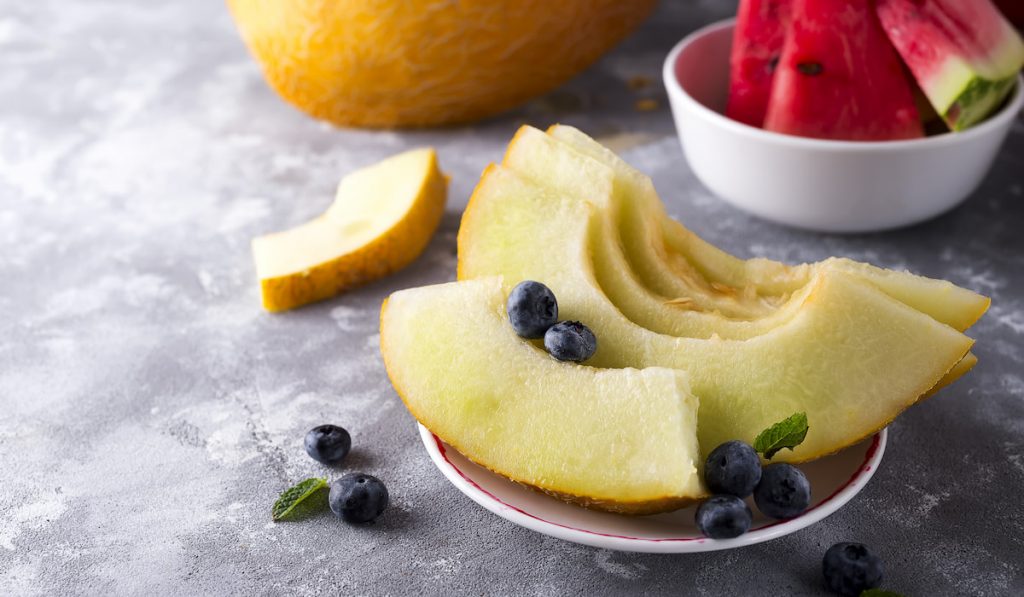 sliced-yellow-melon-slices-of-watermelon-and-blueberries
