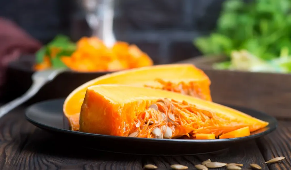 slices of pumpkin on black plate